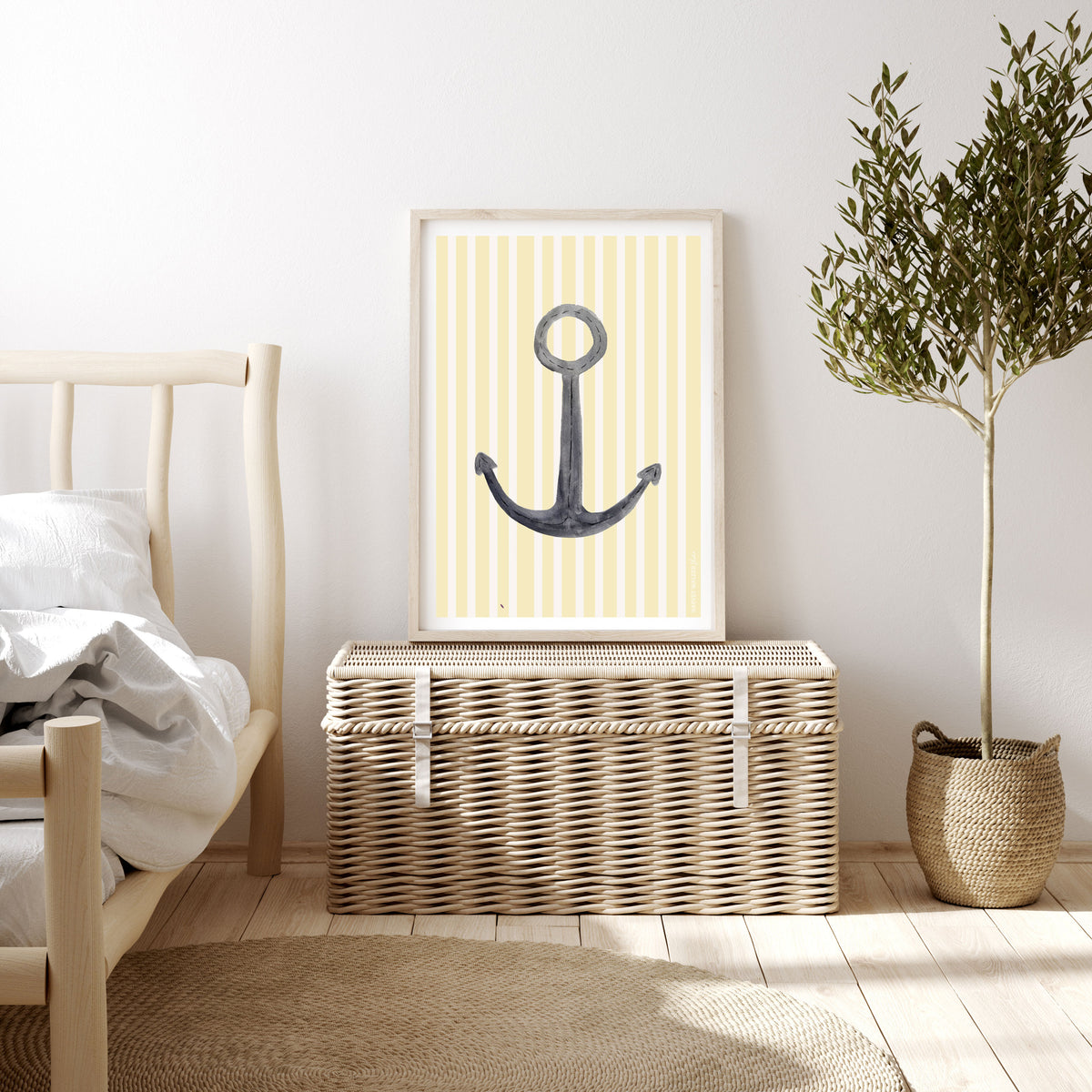 Framed fine art nautical anchor print positioned in minimalist holiday bedroom. Printed on giclee textured cotton rag 310g, with yellow and white stripe background. classic anchor watercolour illustration. 