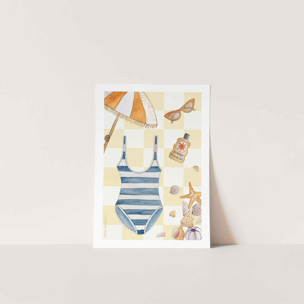 Unframed fine art print. Retreat to the beach with this yellow and white check print. With umbrellas, swimsuits and shells this print is perfect for giving you a feeling of being on holiday every day. Lovingly hand illustrated and great for house warming presents.