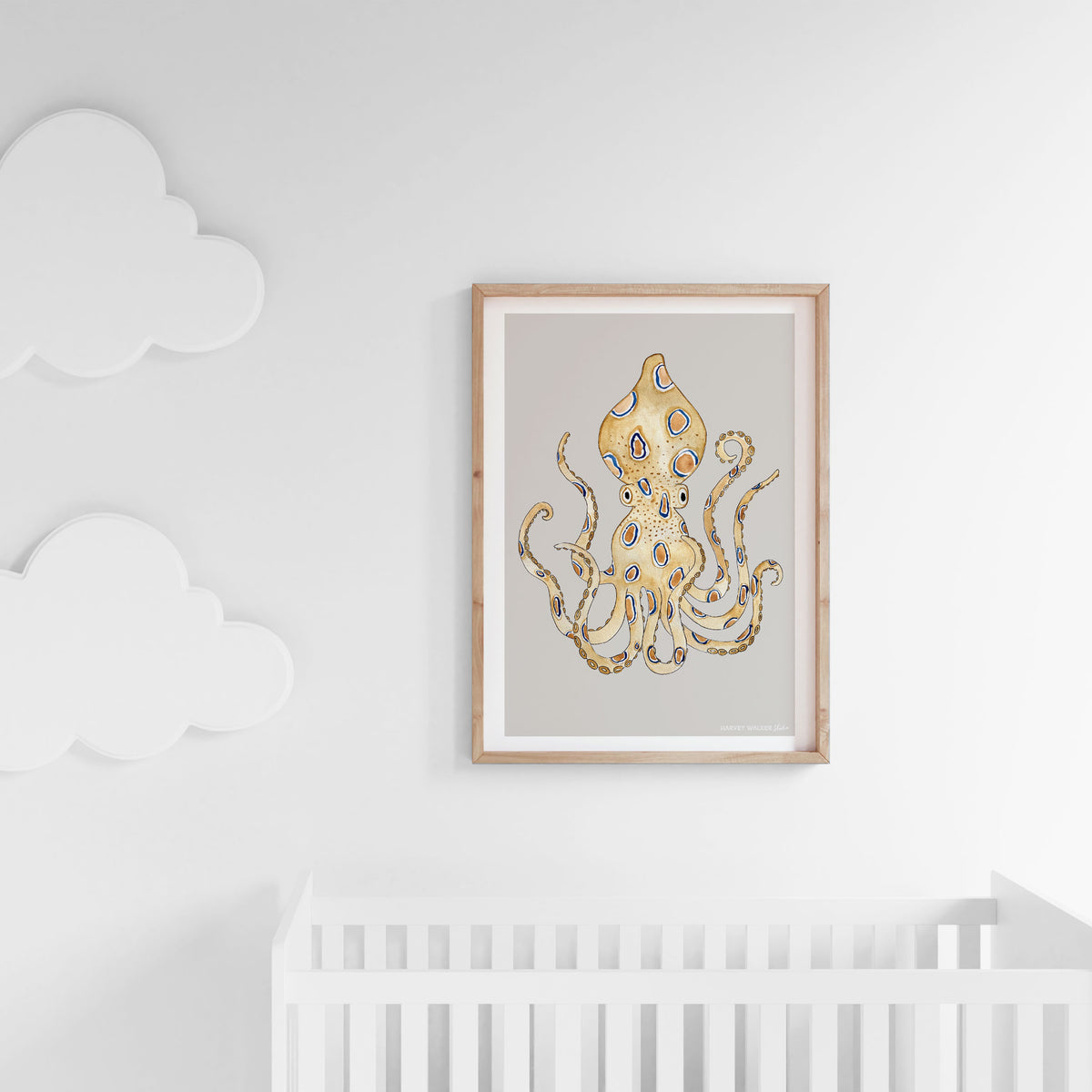 Professionally framed in Australian Oak, this fine art print has been hand watercolored in a neutral palette. Painted with watercolours, this beautiful print is perfect for a kids nursery as shown here in a white baby nursery above a white cot and cloud lights.