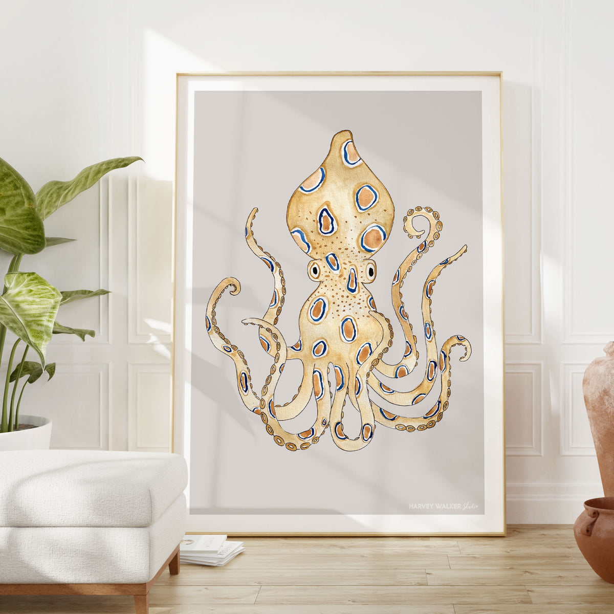 Large format blue ring octopus illustration in A1 shown here in a modern mid century living room. Bring a fun coastal vibe to your space with this hand illustrated print.